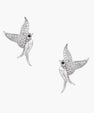 Pair of white gold-plated hummingbird stud earrings with pavé zirconia stones and teardrop crystal bodies on cream background