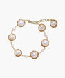 Gold wire-wrapped freshwater pearl bracelet with alternating pearl sizes on cream background, adjustable length