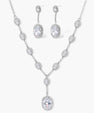 Elegant white gold plated jewelry set with oval cubic zirconia stones in halo settings, featuring Y-necklace and drop earrings.