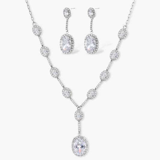Elegant white gold plated jewelry set with oval cubic zirconia stones in halo settings, featuring Y-necklace and drop earrings.